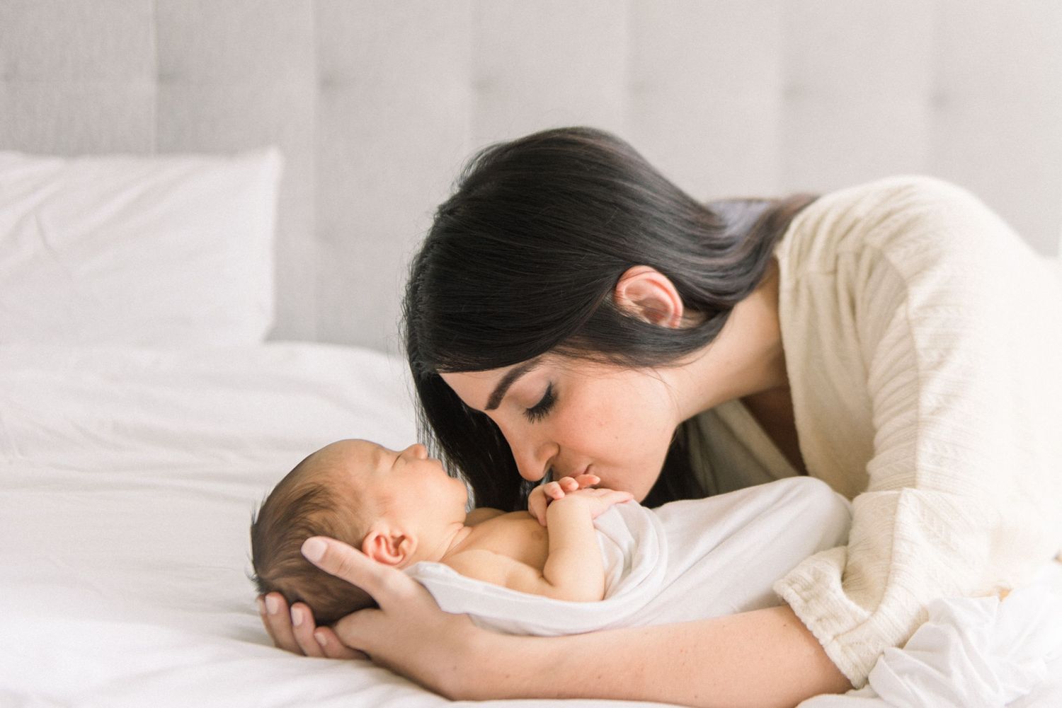 mom kissing baby at Washington DC Newborn session