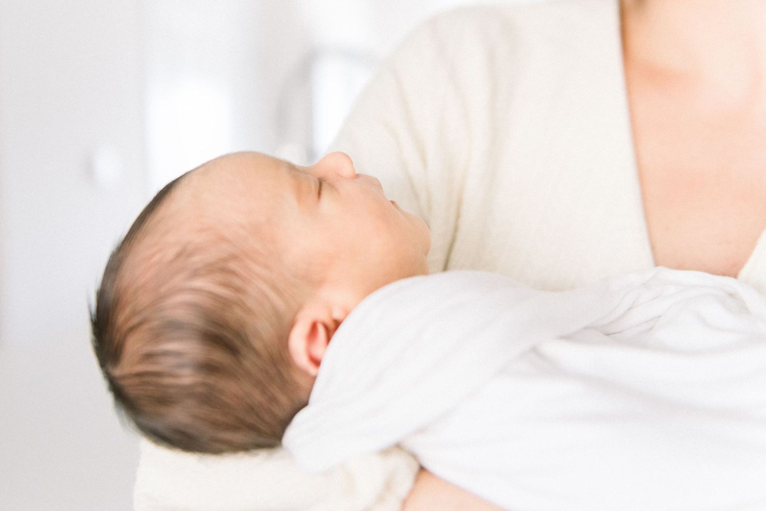 baby in mother's arms at Washington DC Newborn session