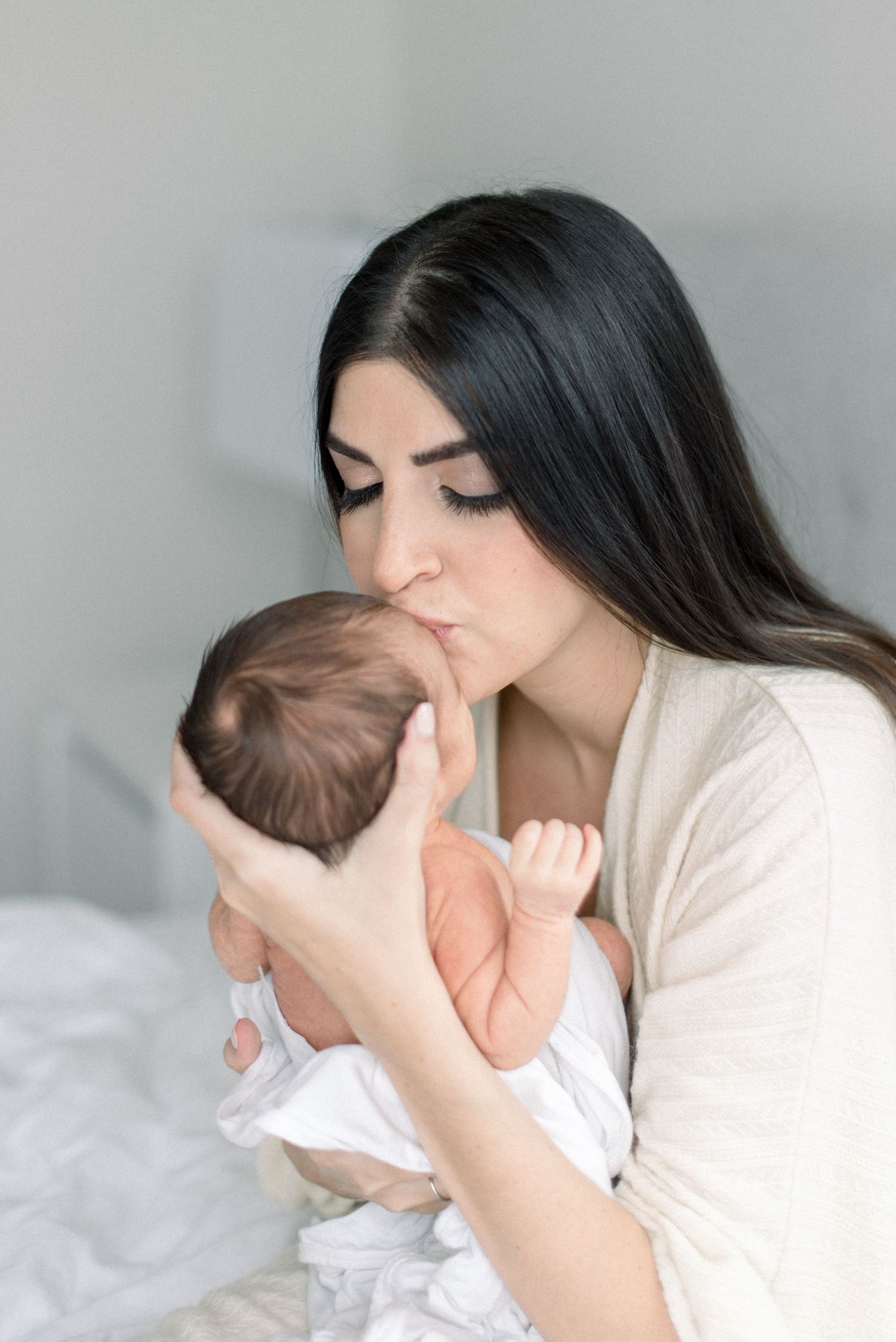 mom kissing babe at Washington DC Newborn session