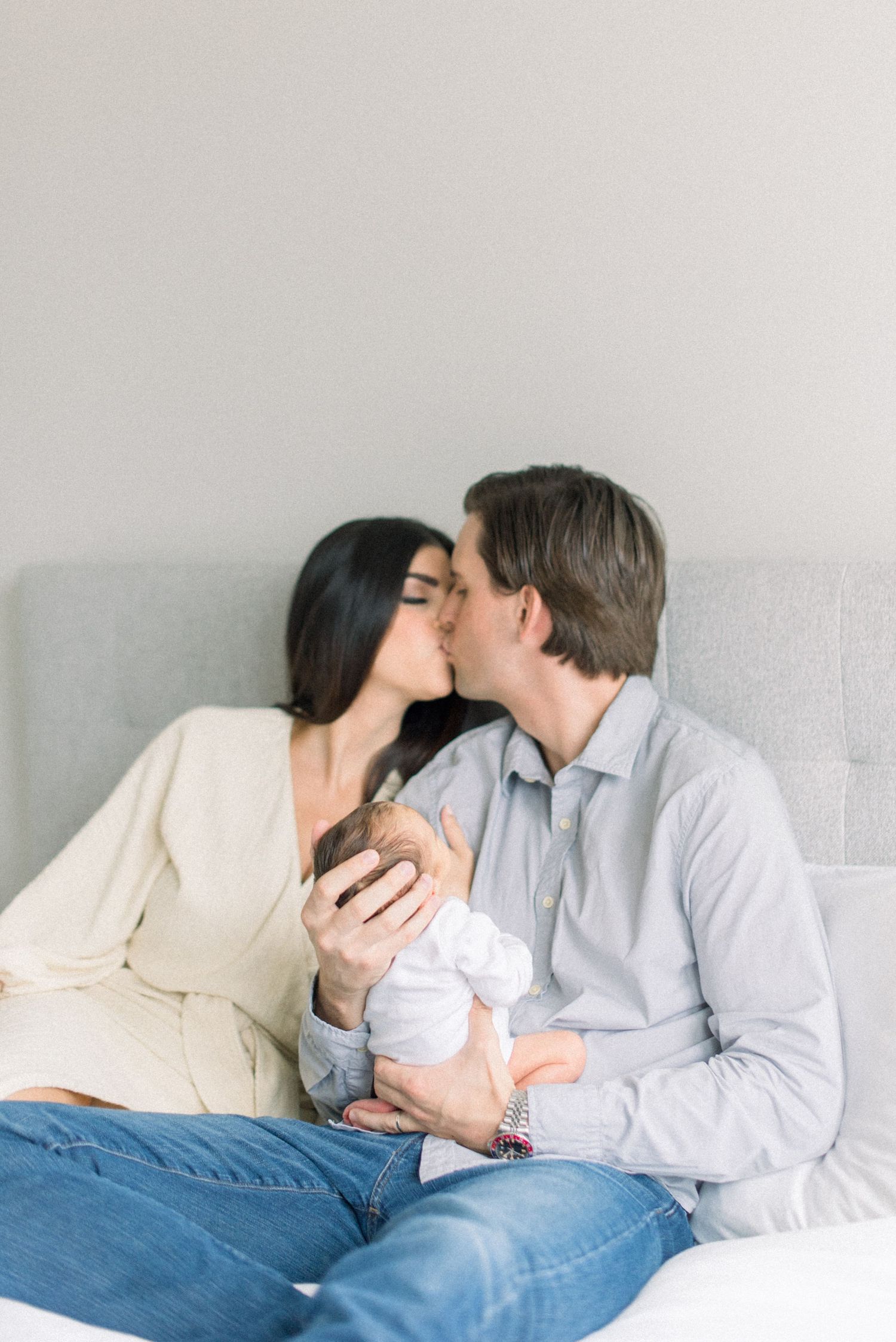 mom and dad posed kissing at Washington DC Newborn session