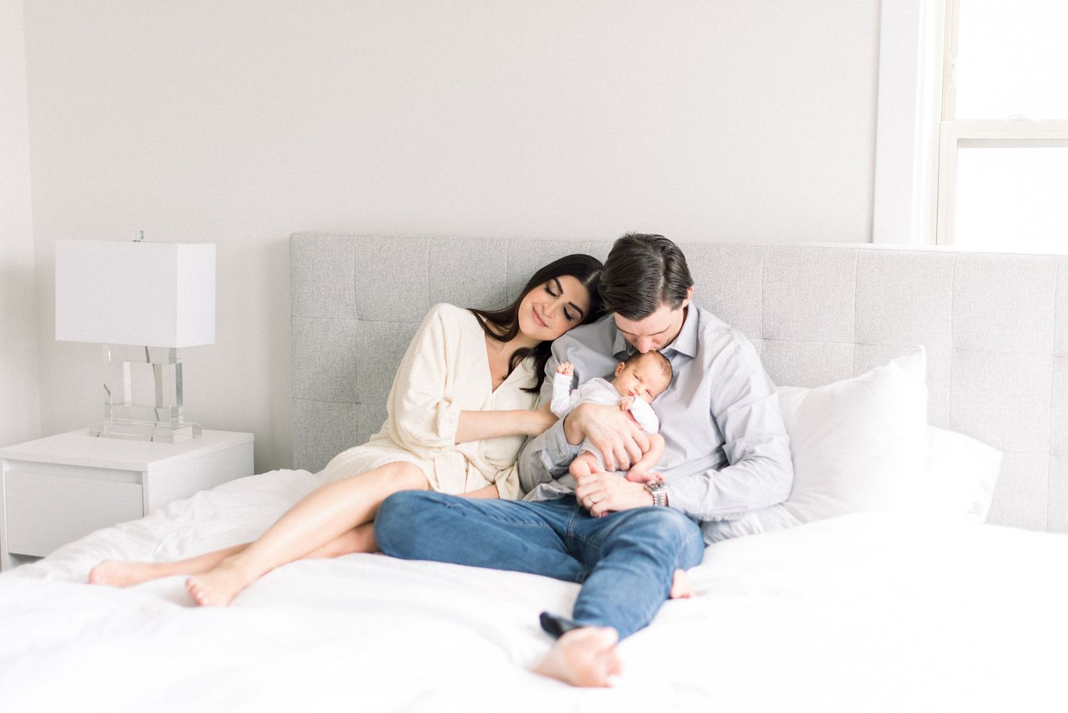 mom and dad snuggling baby at their newborn session in Washington DC