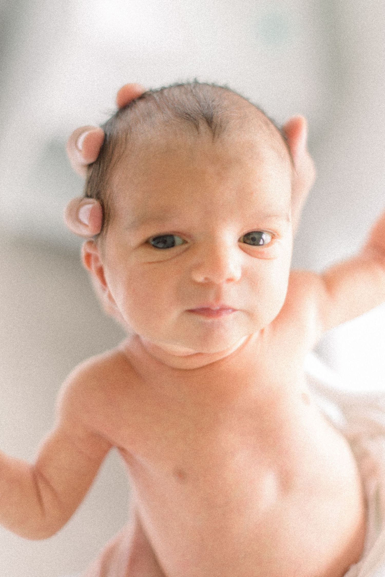 close up of baby staring at camera at Washington DC Newborn session