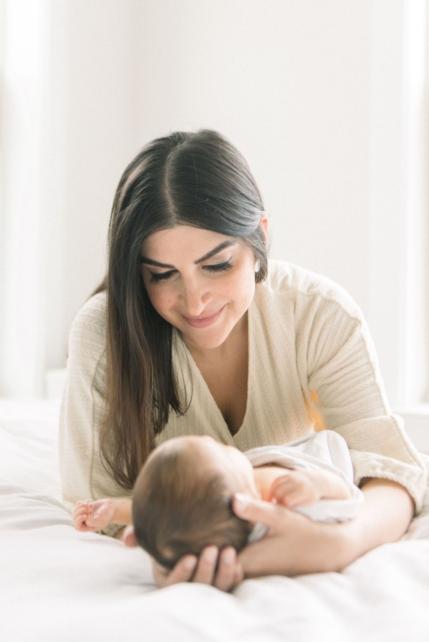 mom staring at baby at Washington DC Newborn session