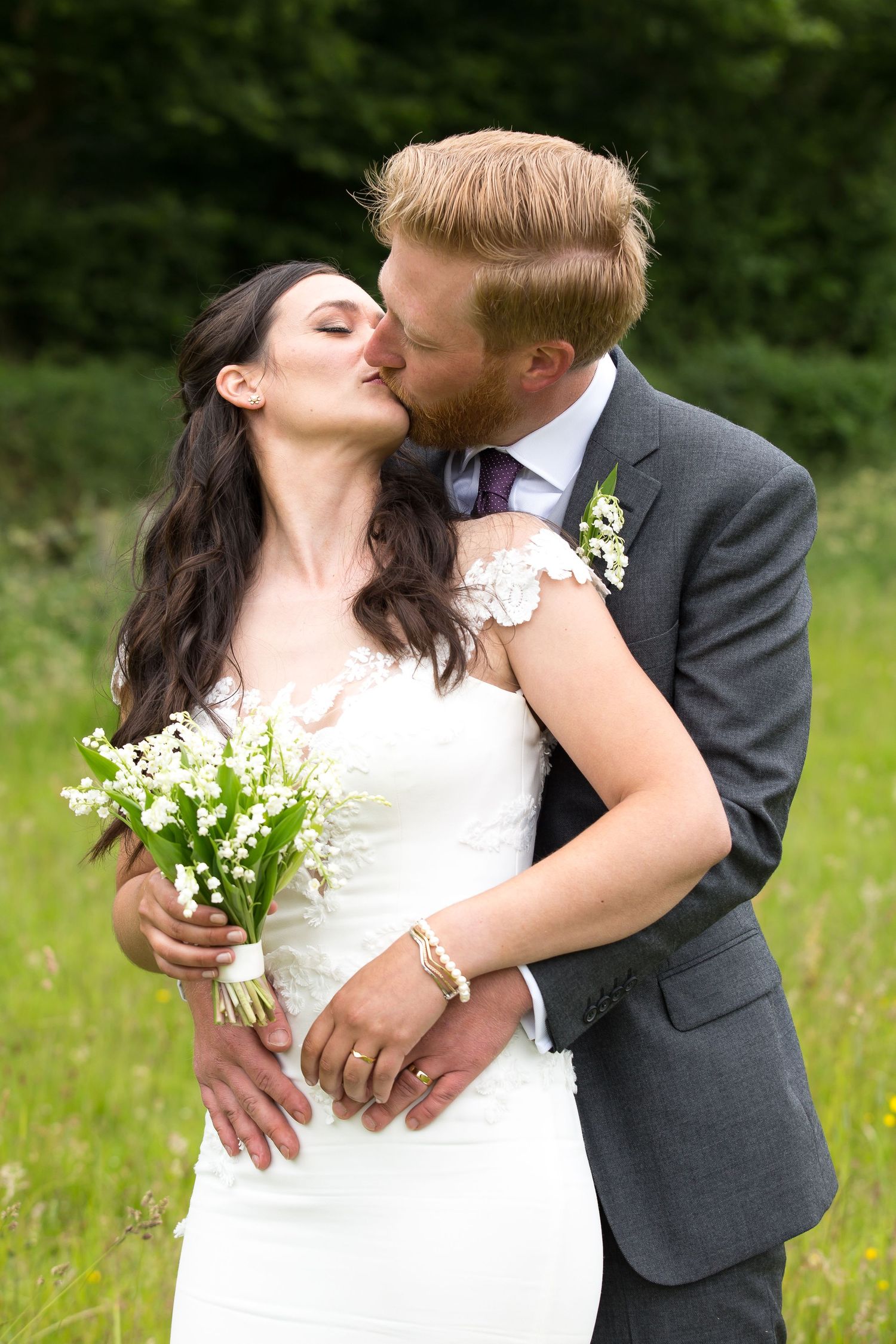 Bride and Groom just married first kiss in Vernham Dean as husband and wife. Couple dressed in wedding attire