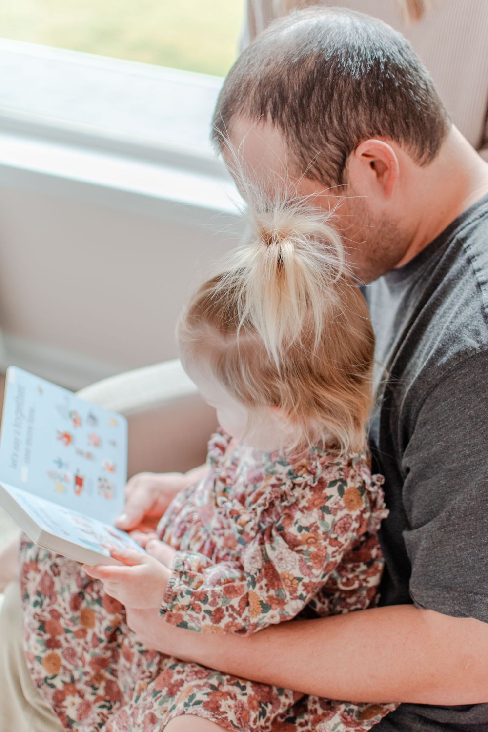 A dad shares a story with his daughter.