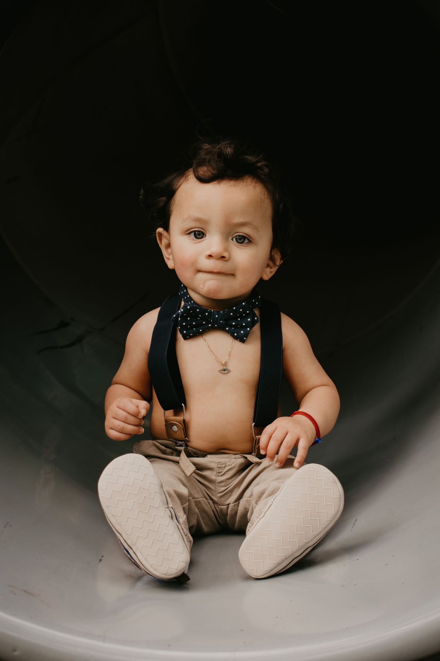 boy sitting in slide