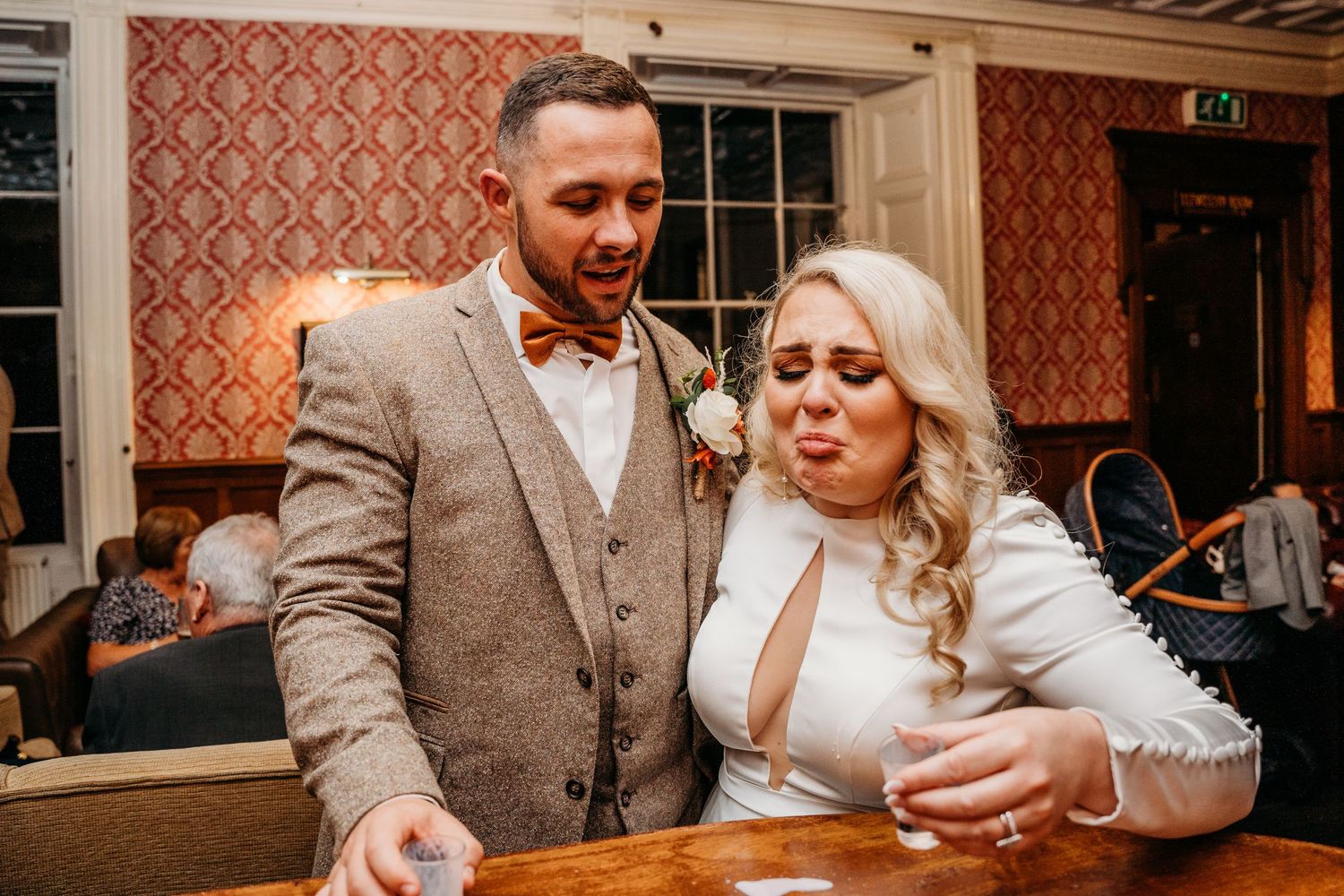 Candid moment at wedding reception with couple enjoying festivities.