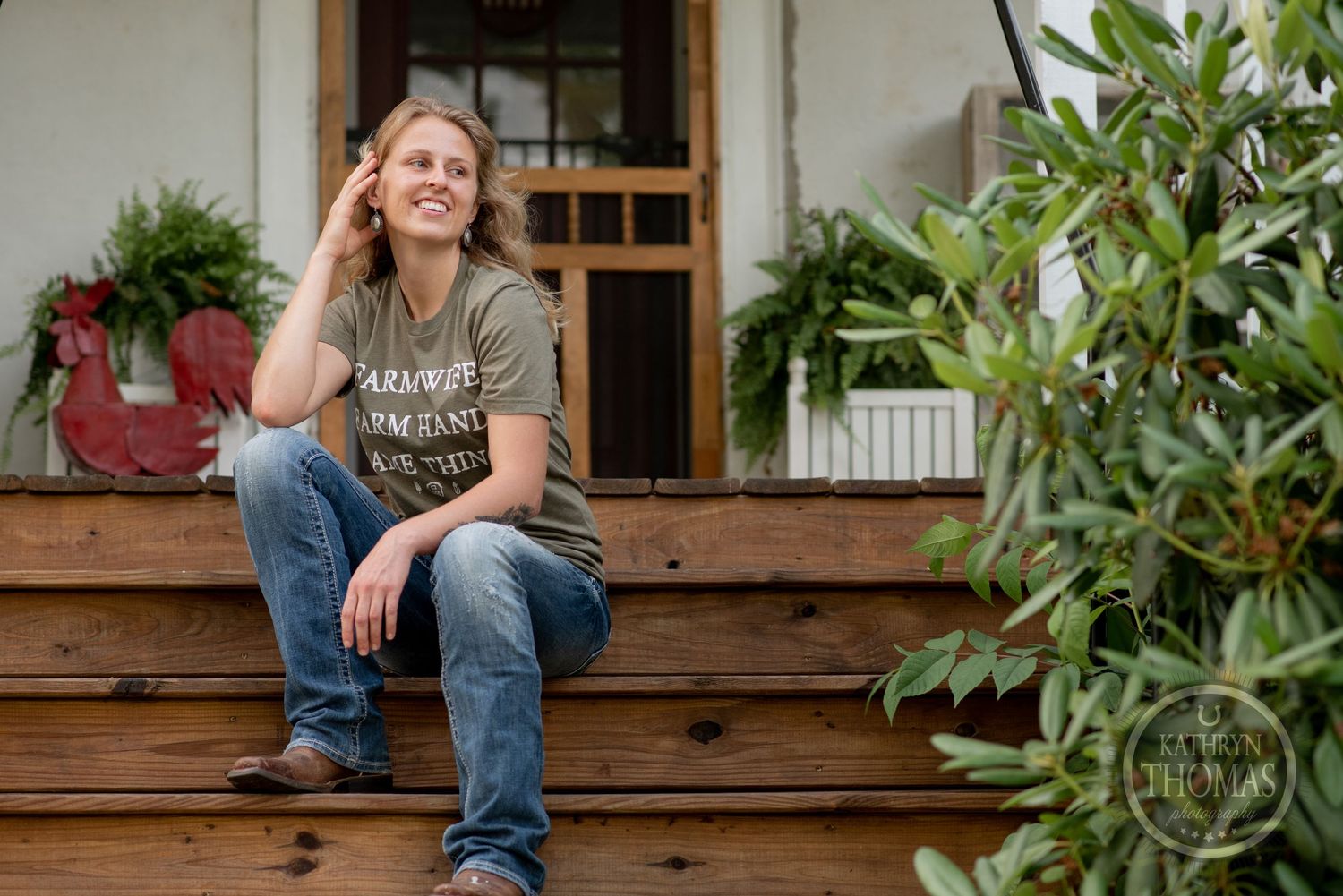 A relaxed outdoor scene on wooden porch steps with potted plants and greenery.