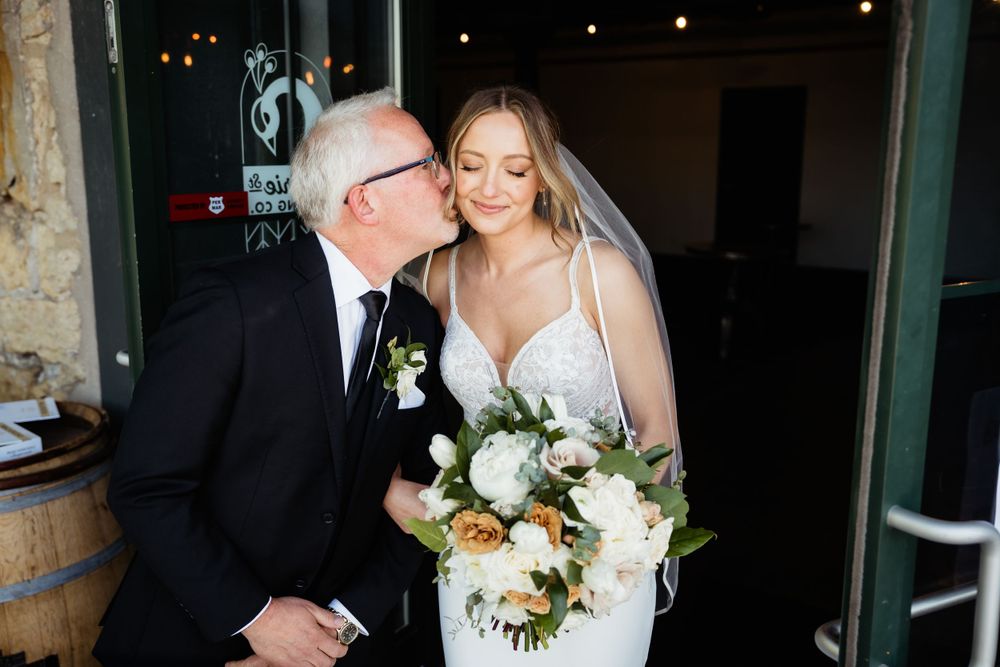 Tender moment captured during wedding celebrations.