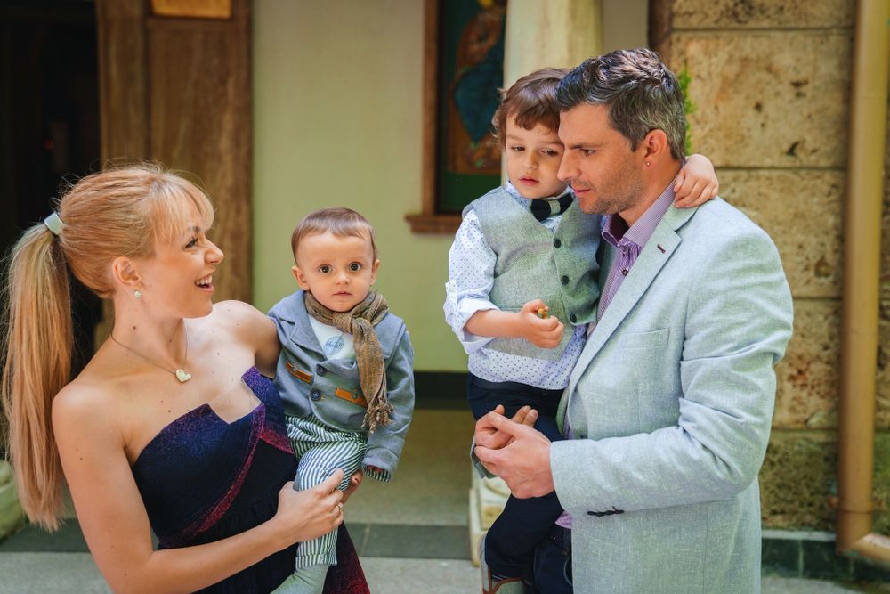 Family gathering outside church during a special celebration.