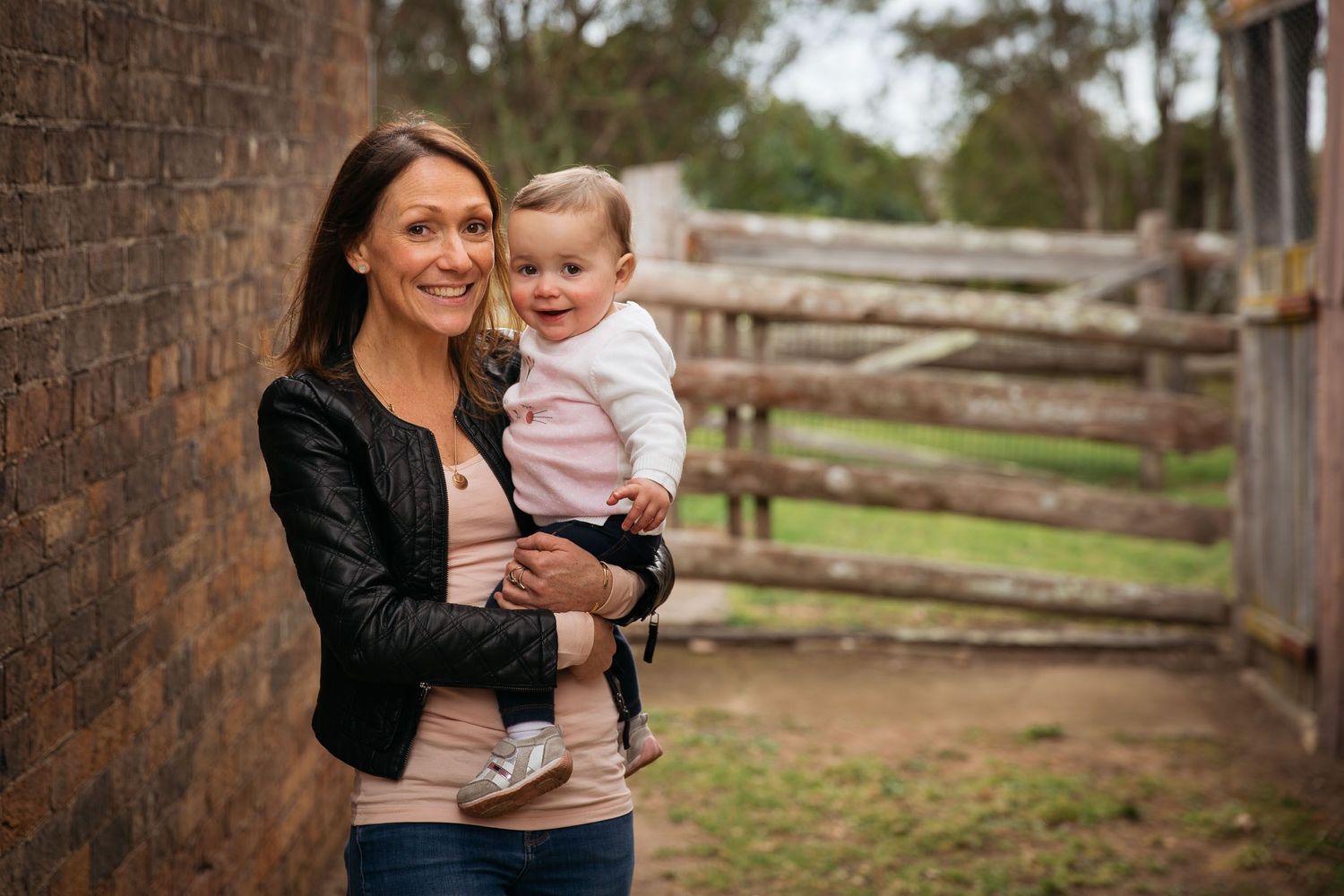 Mum holding baby girl in Fagan Park
