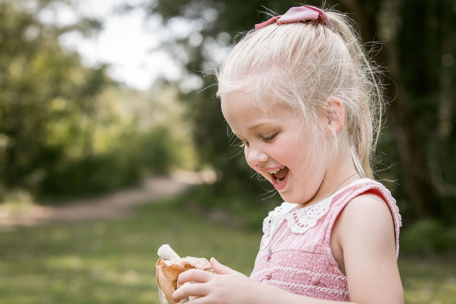 Young girl in pink smiling