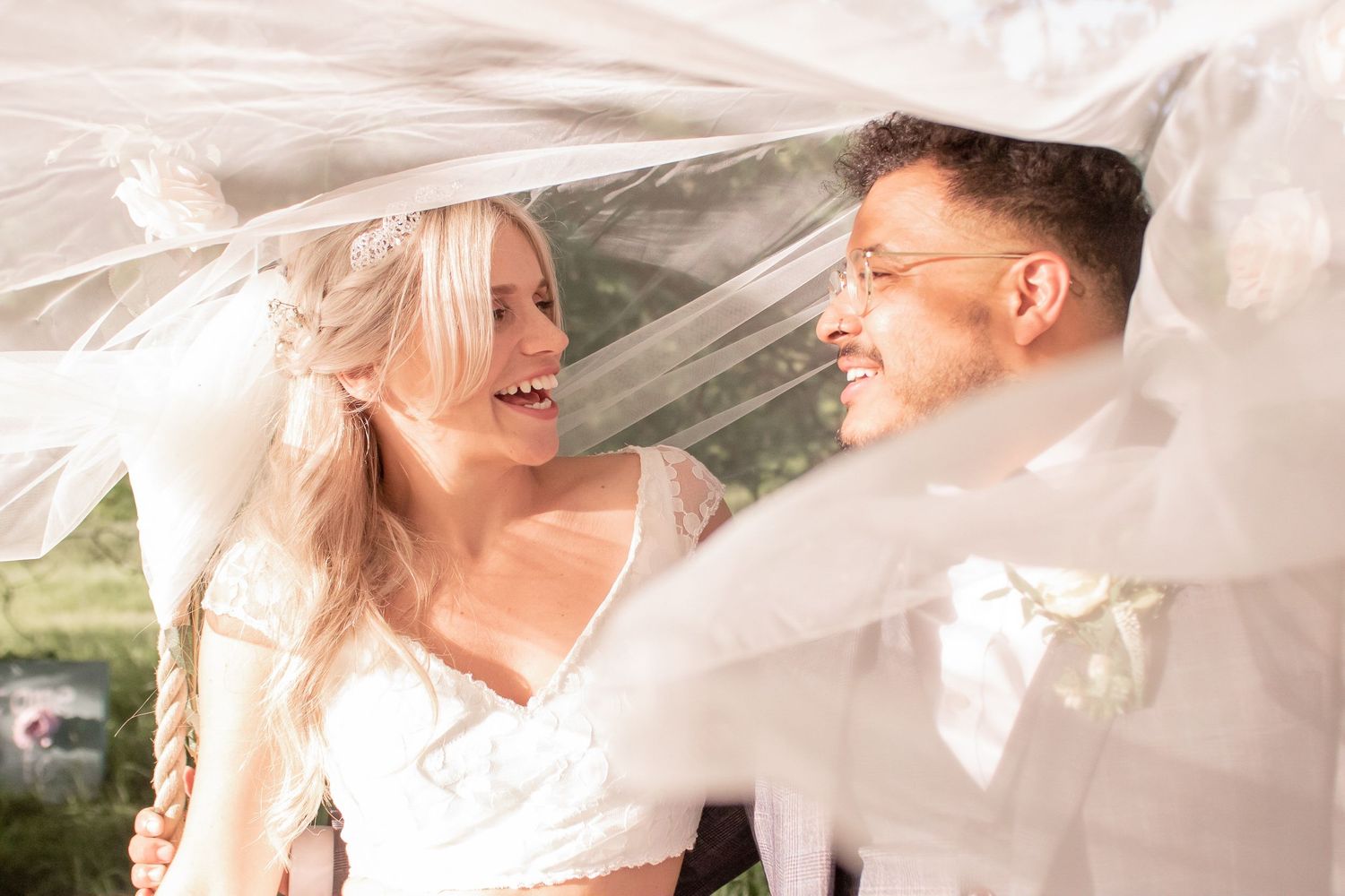 close up of bride and groom under veil