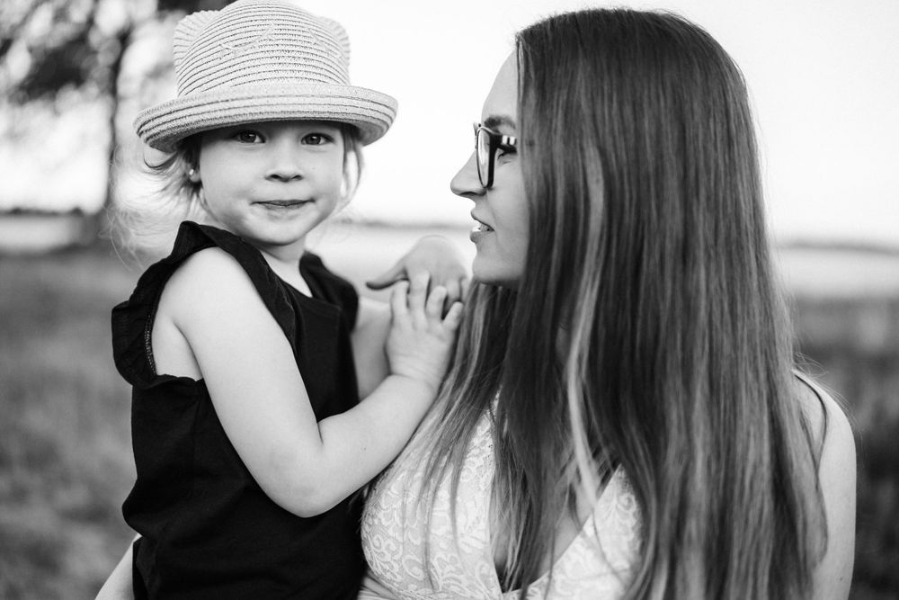Black and white portrait showcasing gentle connection and tenderness.