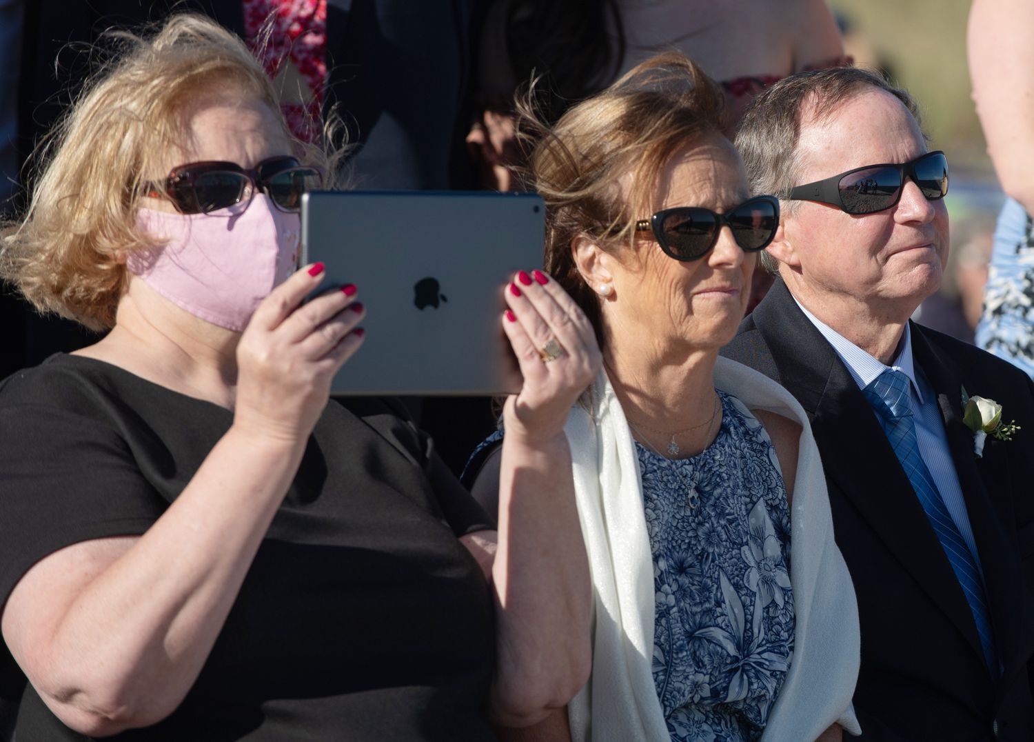 Wedding guests wearing sunglasses outdoors in a candid photo sequence.