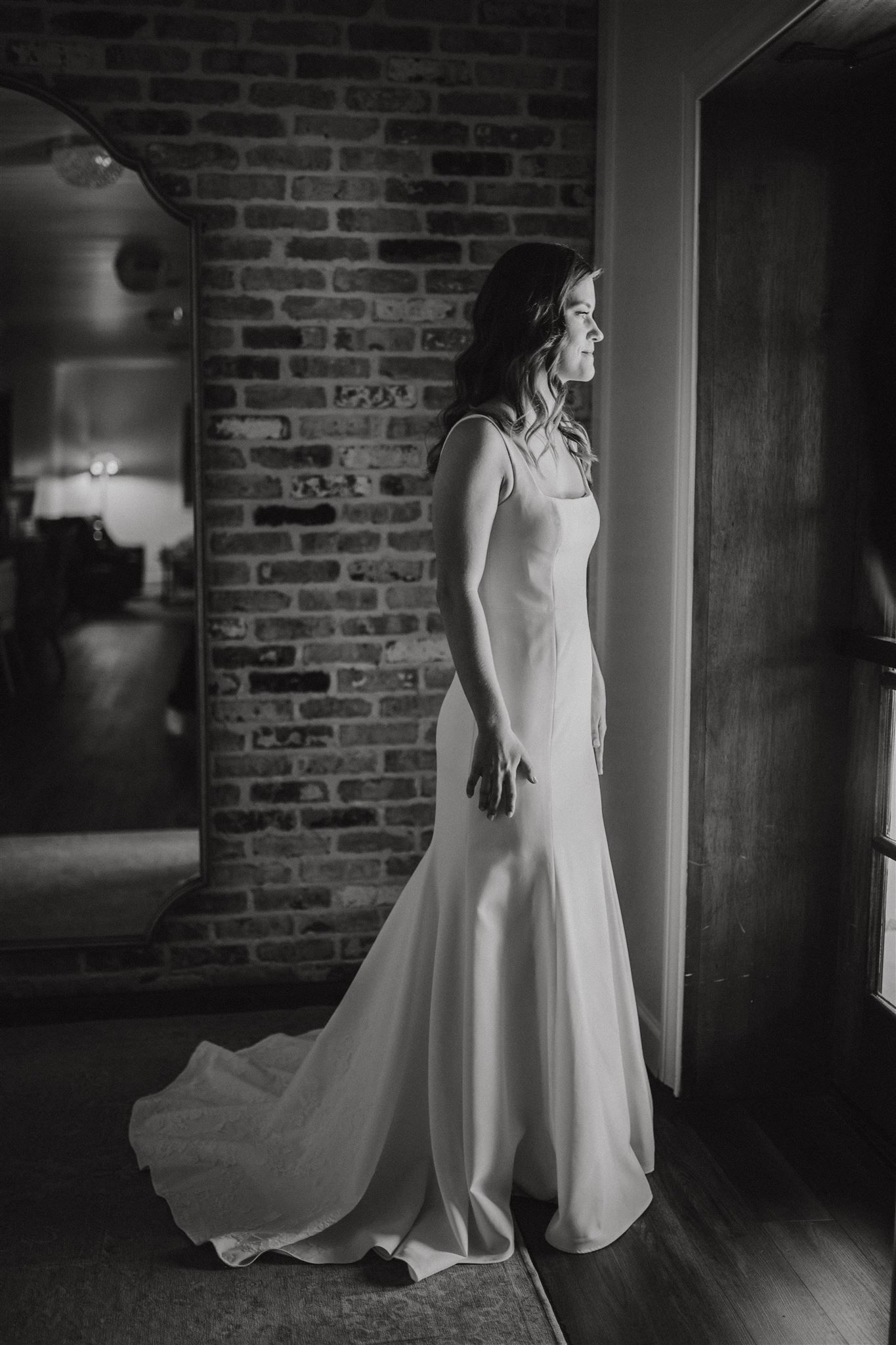 bridal portrait in black and white, taken at Carriage House venue in Conroe, Tx