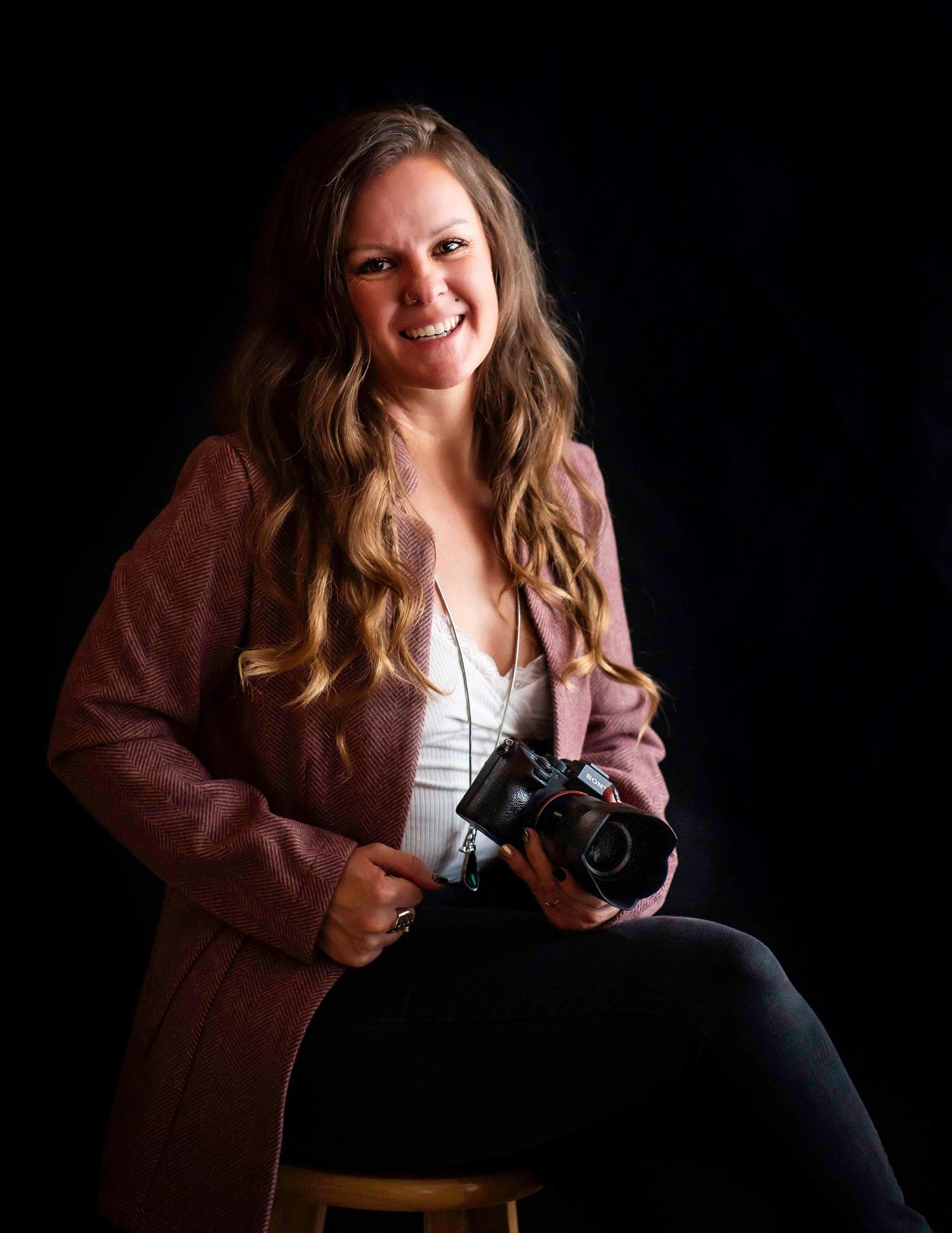 photographer headshot holding a camera