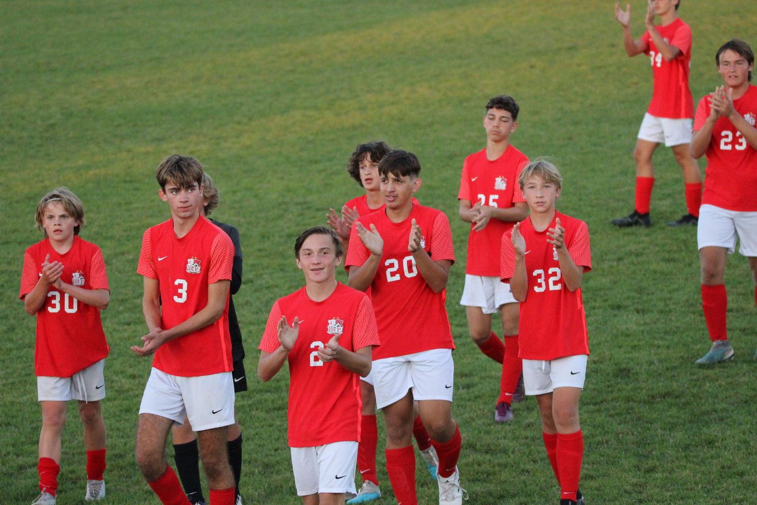 soccer team thanking spectators for watching
