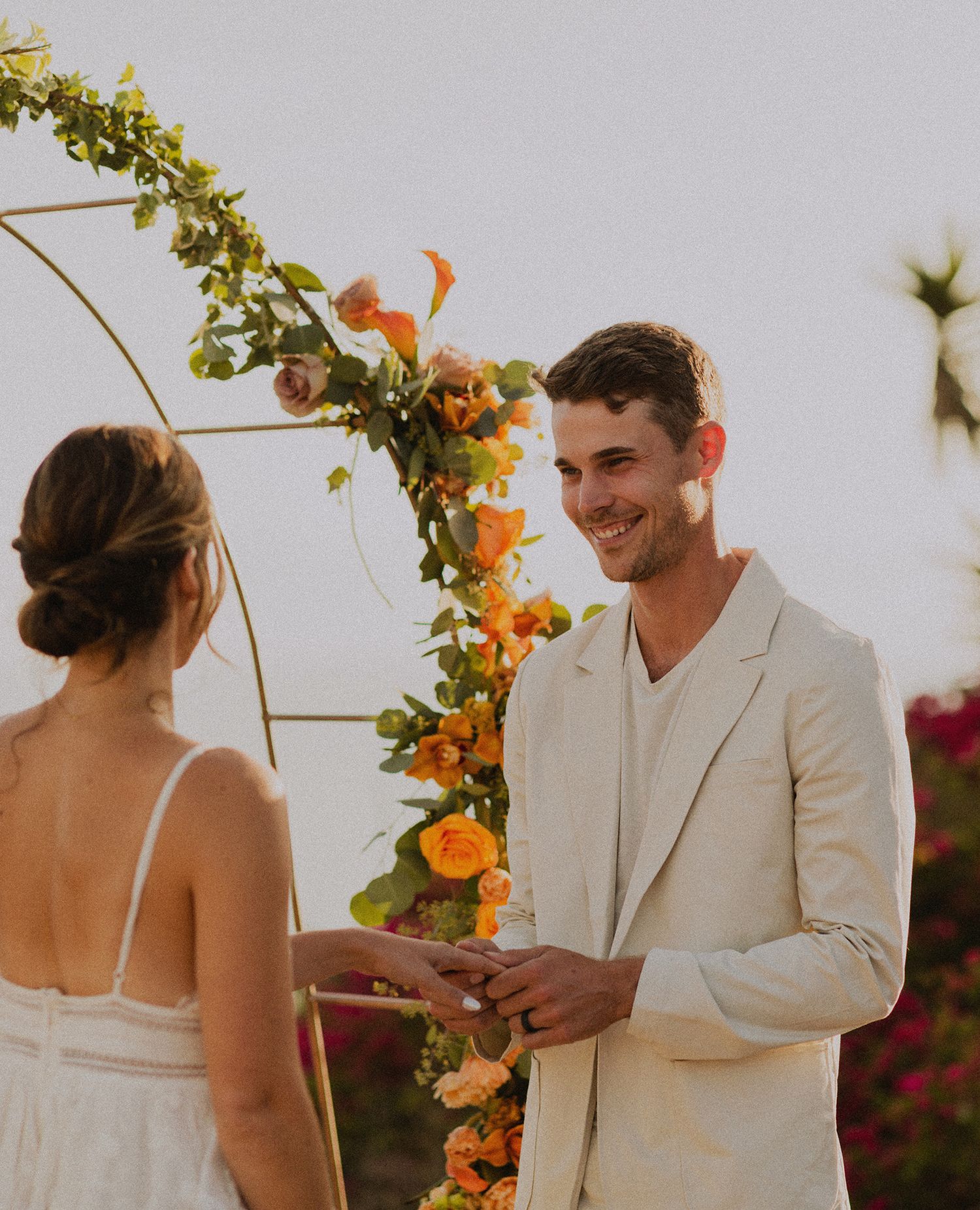 Shot of groom seeing bride in Palos Verdes cliffs wedding overlooking the ocean