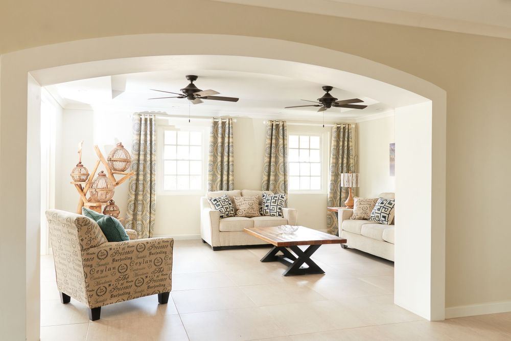 Open concept living area featuring arched doorways and contemporary furnishings.