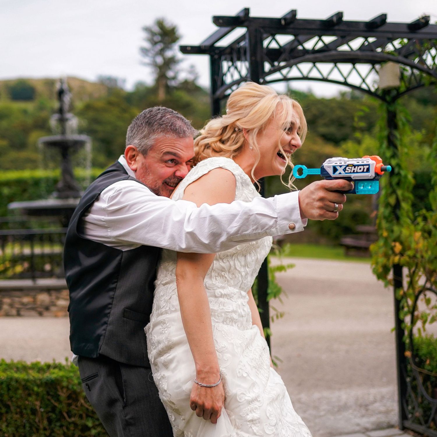 Groom uses the bride as a human shield during a nerf gun fight