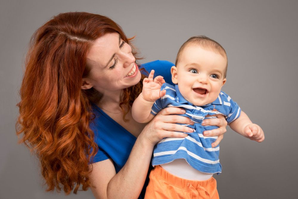Mum smiling at her baby boy.