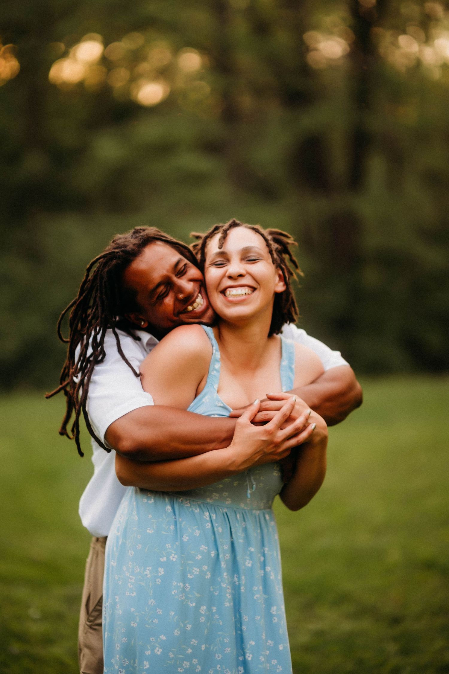 A couple shares a moment of pure joy and happiness during their photography session