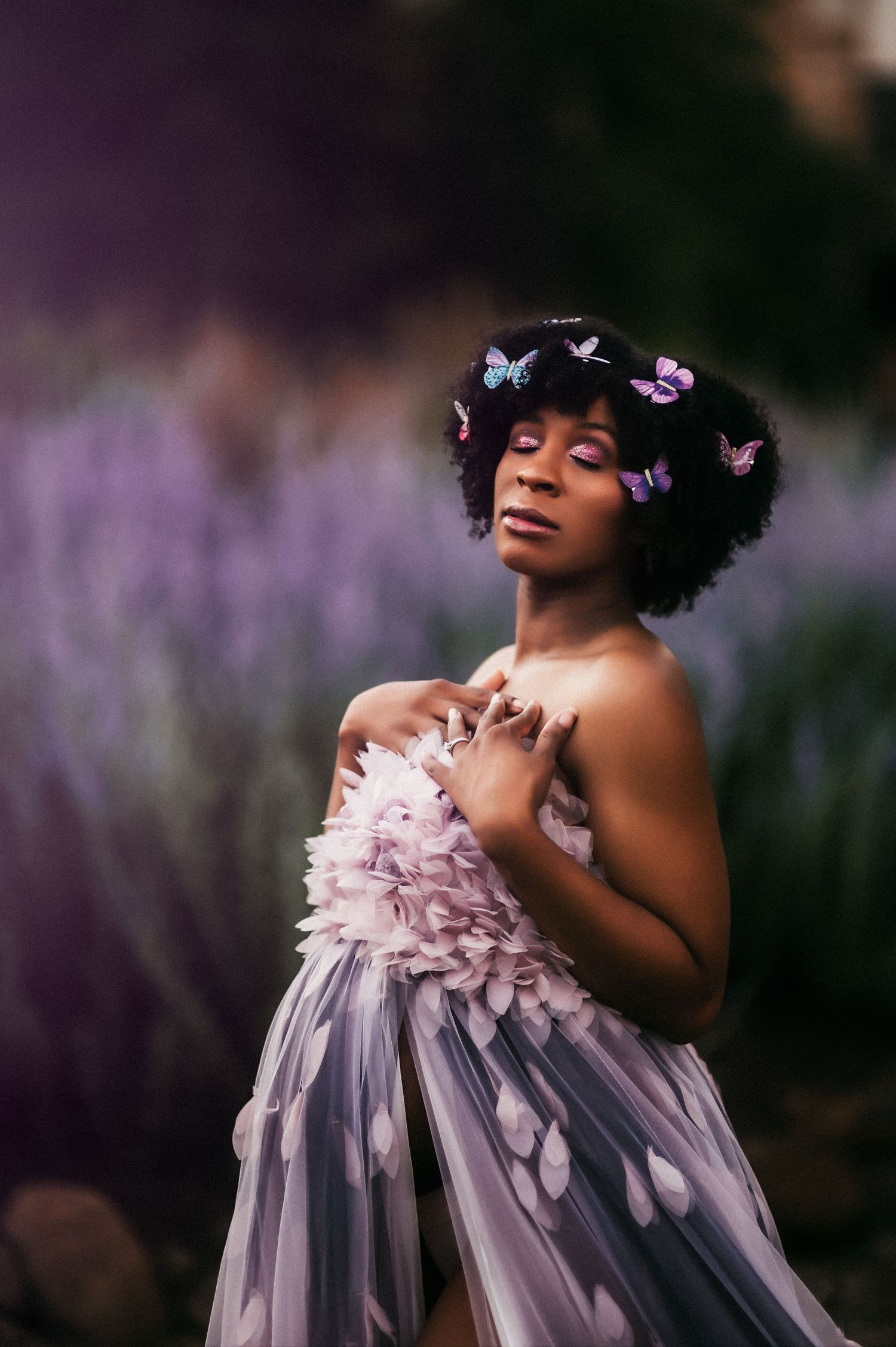 Close up portrait african american pregnant woman standing in a lavender field