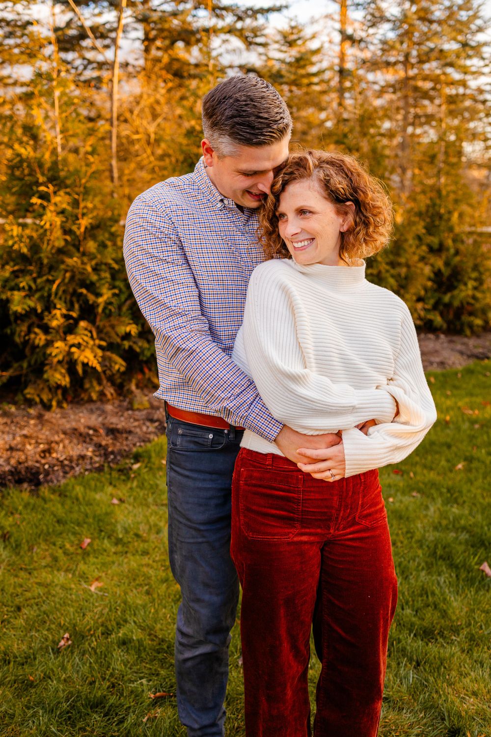Couple hugging in the fall