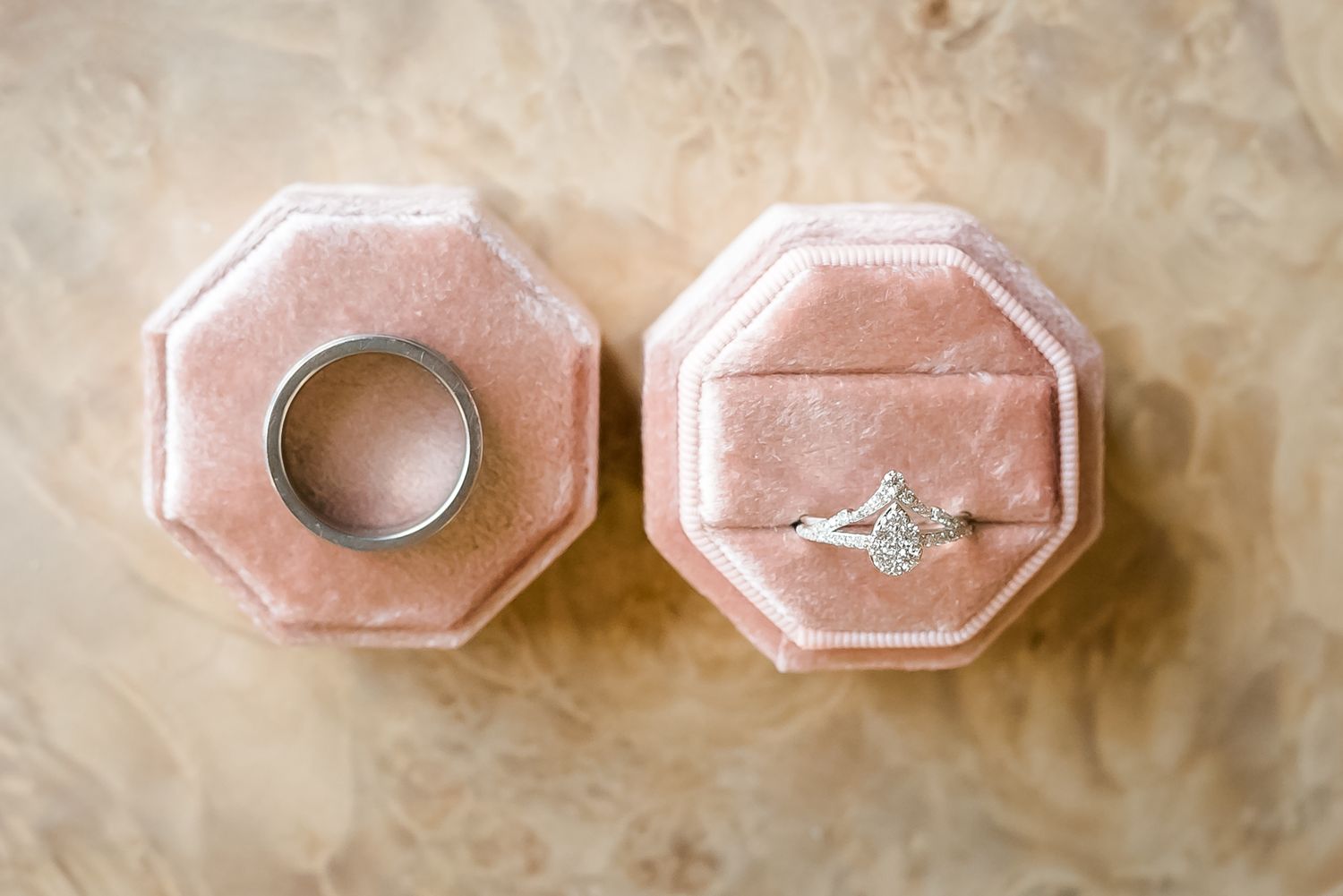 Wedding rings neslted in a rose coloured velvet ring box. Photo taken in Vancouver by Kari Mills Photography.