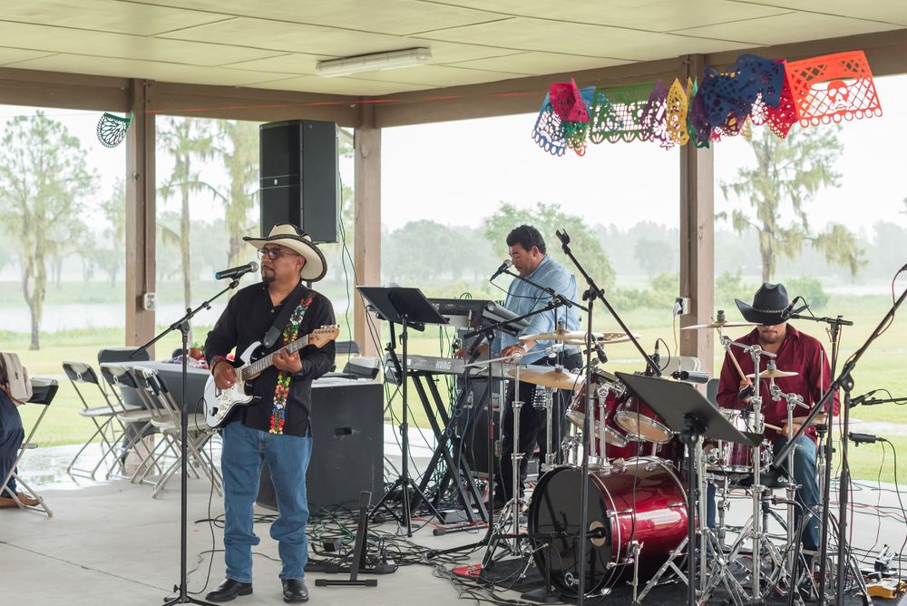 a band plays at a quinceanera party at Hardee Lakes County Park in Bowling Green, Florida