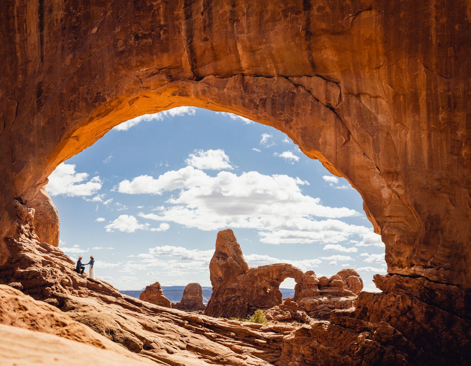 Arches National Park Windows Section. North Window with view of Turret Arch and couple all in one shot.