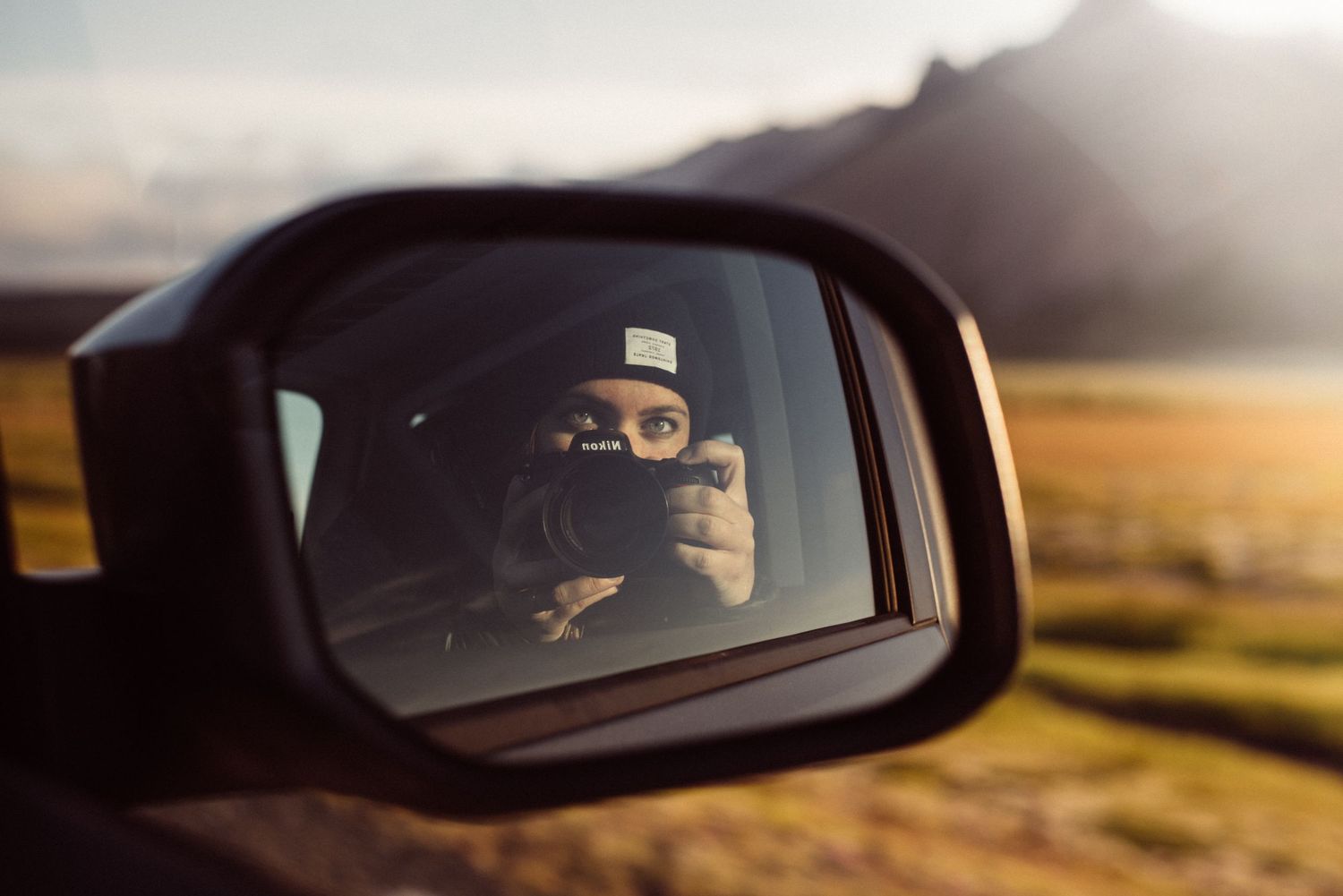 Series of car side mirror reflections during sunset drive.