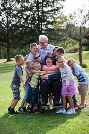 grandma and grandpa with grandkids hugging