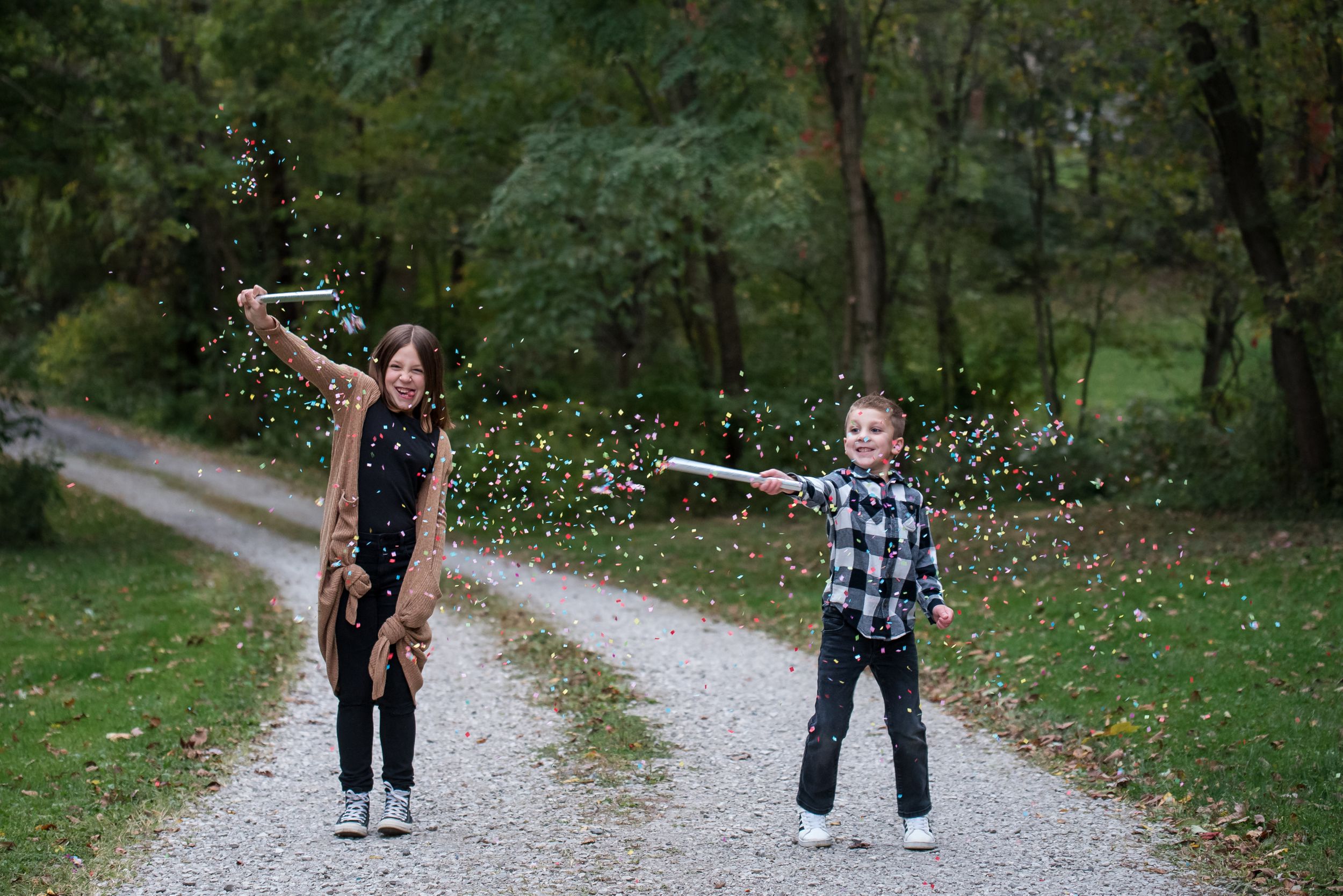 siblings on road with confetti bombs