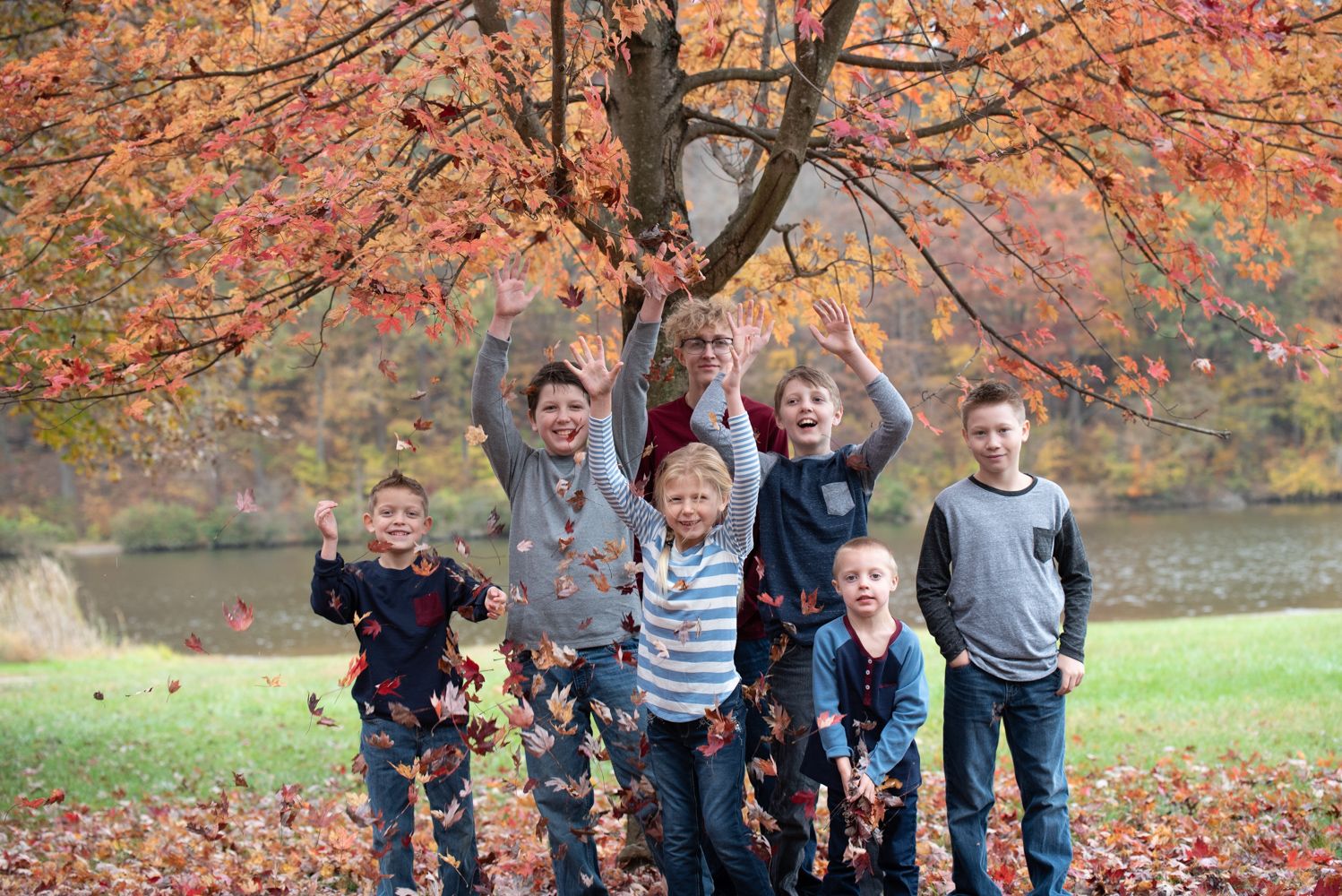 fall kids throwing leaves