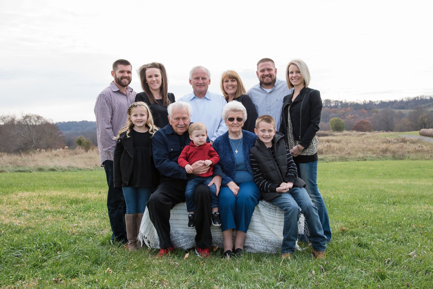 multi generation family photo rural country open field