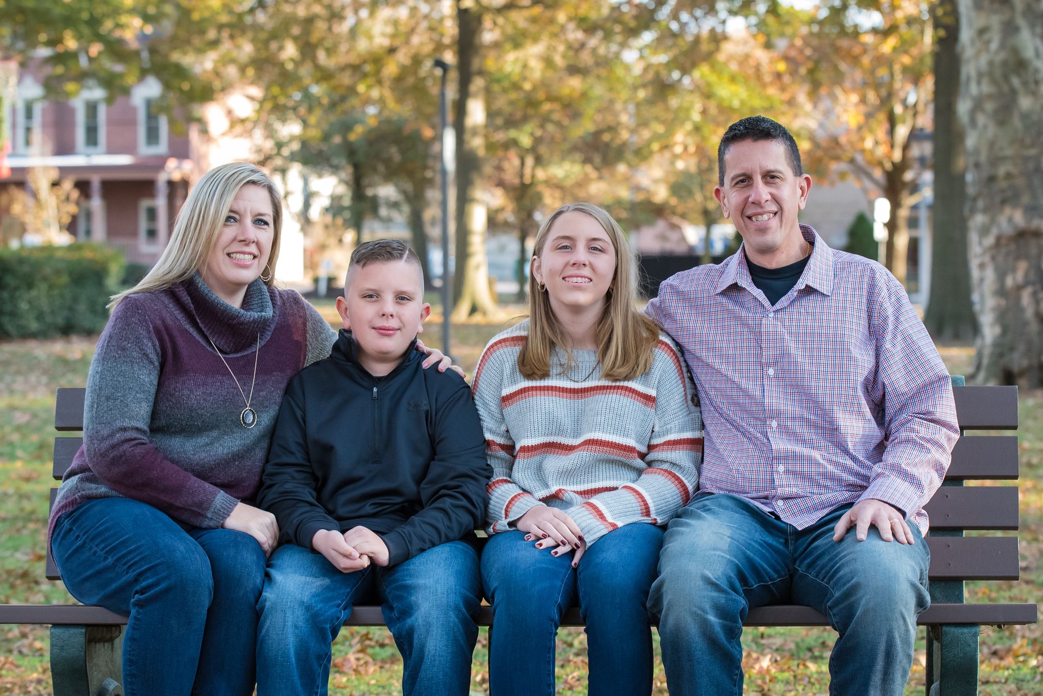 fall family picture with two kids on bench