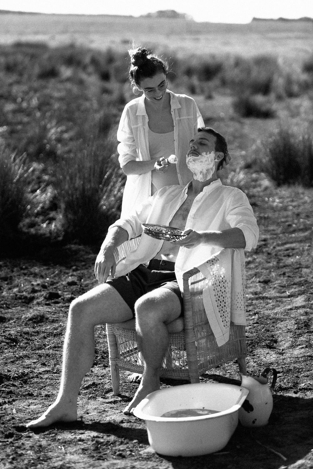 A black and white shot taken at sunrise of a couple.