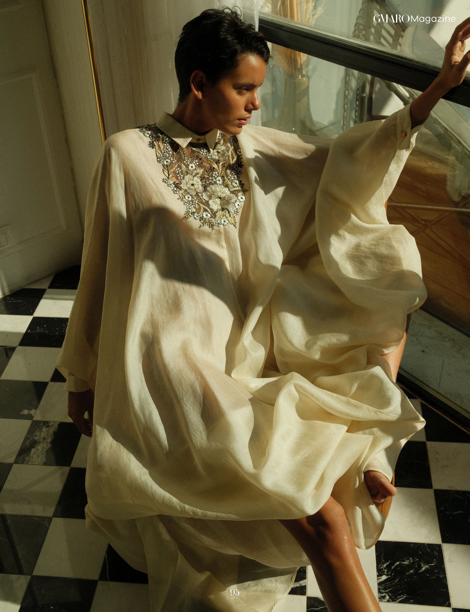 Vibrant fashion shoot with colorful clothing and dynamic pose for magazine editorial.