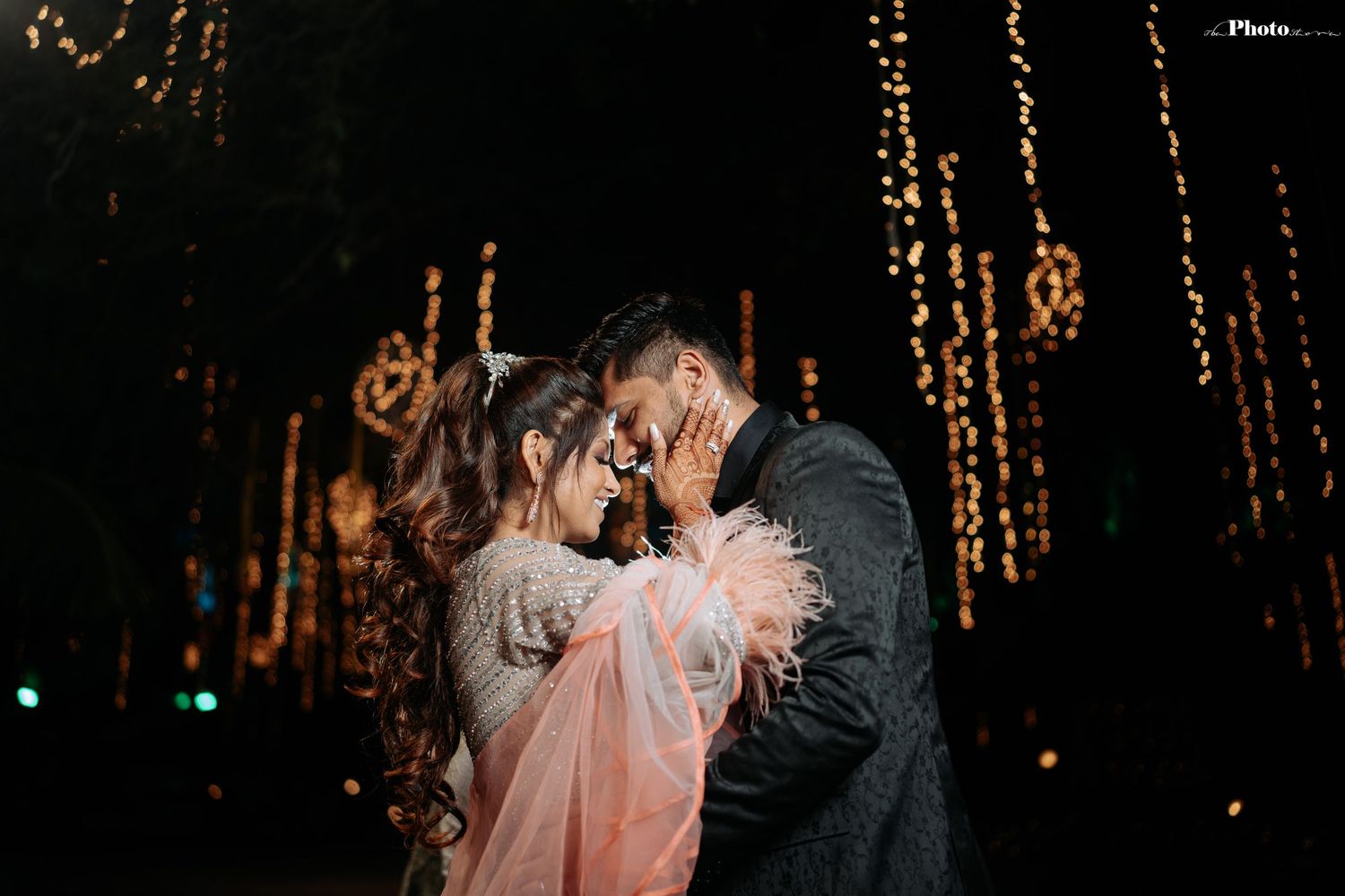 Romantic nighttime celebration with twinkling string lights creating a magical atmosphere.