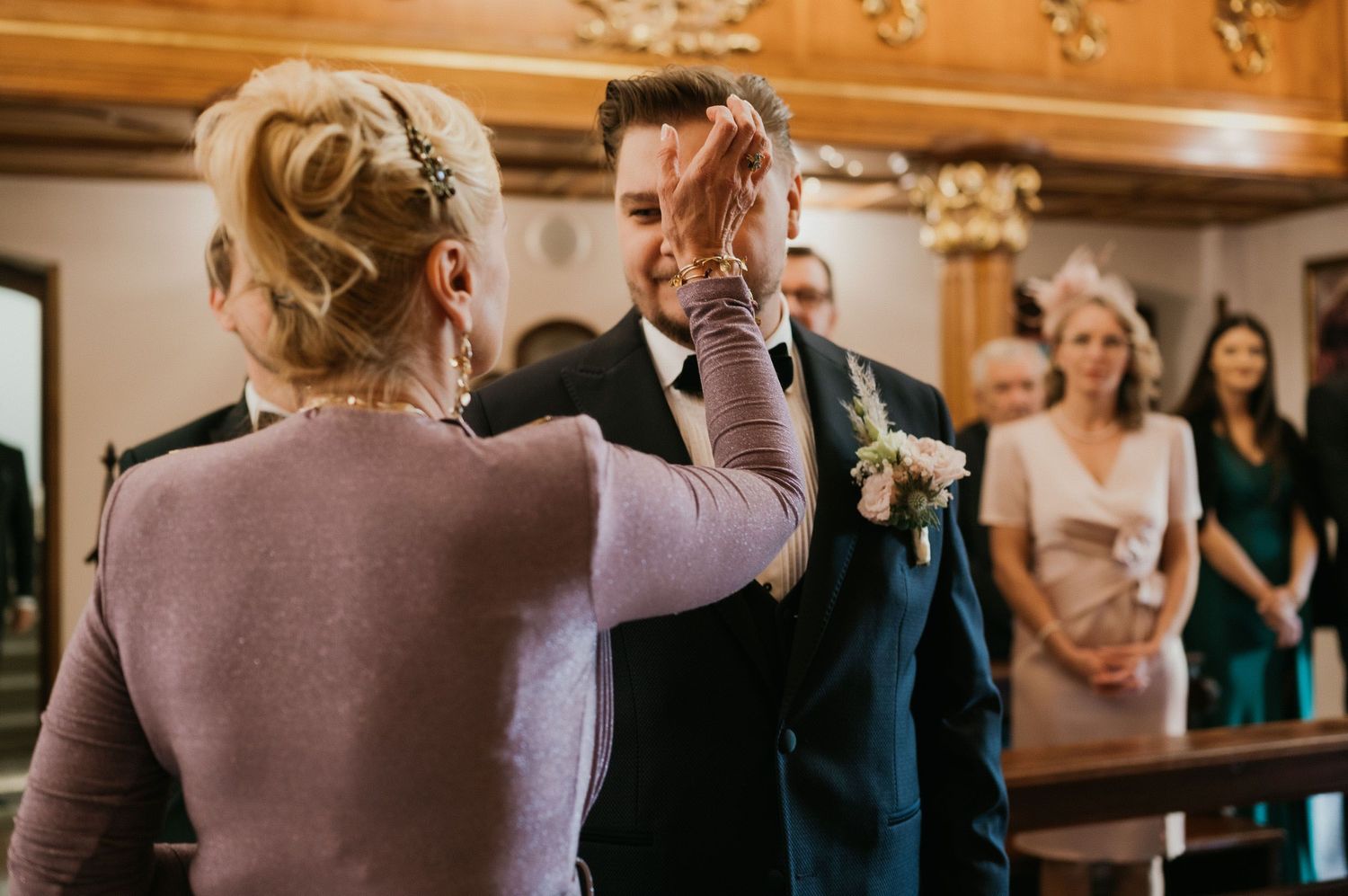 Traditional wedding ceremony taking place in an ornate wood-paneled room.