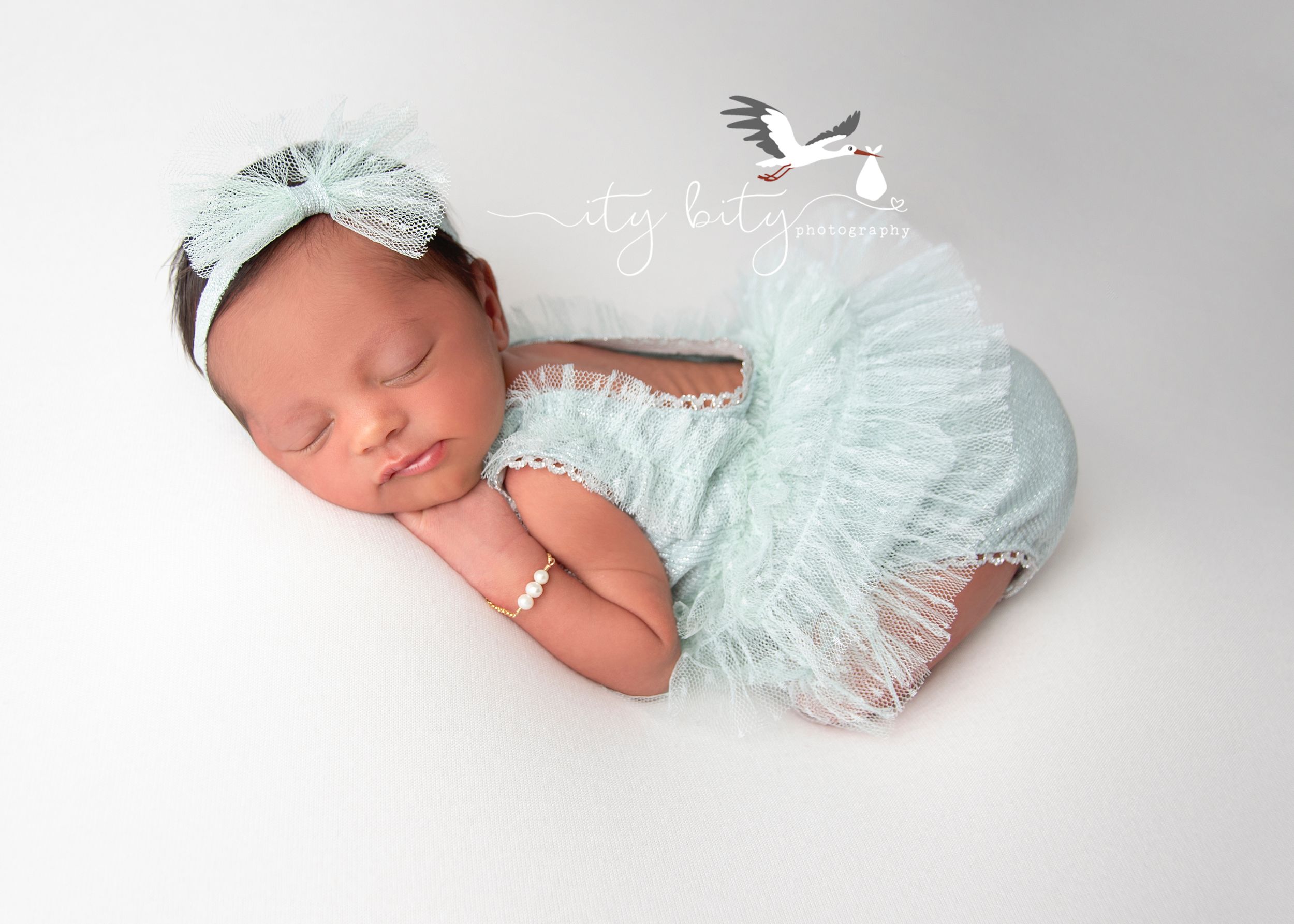 Sweetest Newborn Baby Girl in Mint outfit for Newborn Photography Session in Avon Ohio Cleveland Ity Bity Photography
