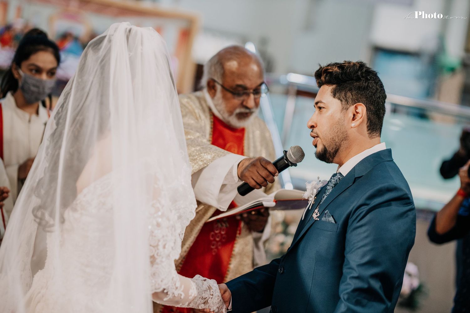 Wedding ceremony taking place in a bright church sanctuary with traditional decor.