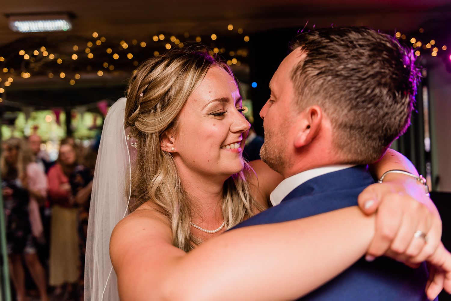 Bride glows during the 1st dance looking into the eyes of her new husband