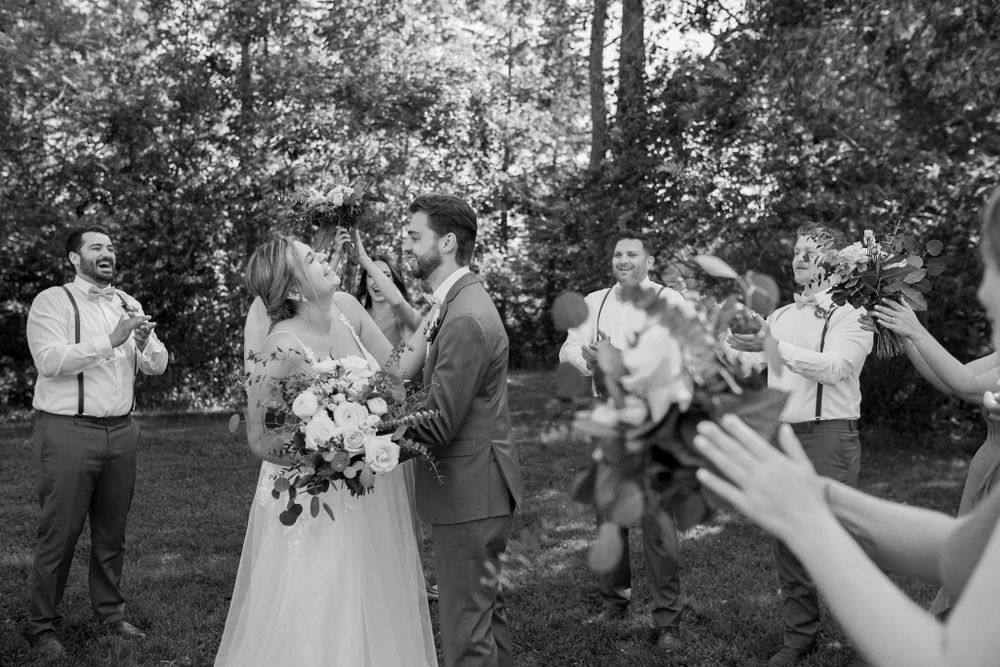 Outdoor wedding photography session in a natural wooded setting.