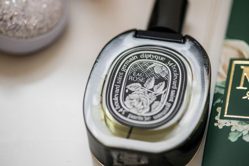 Close-up of a Diptyque luxury candle label with ornate design details.