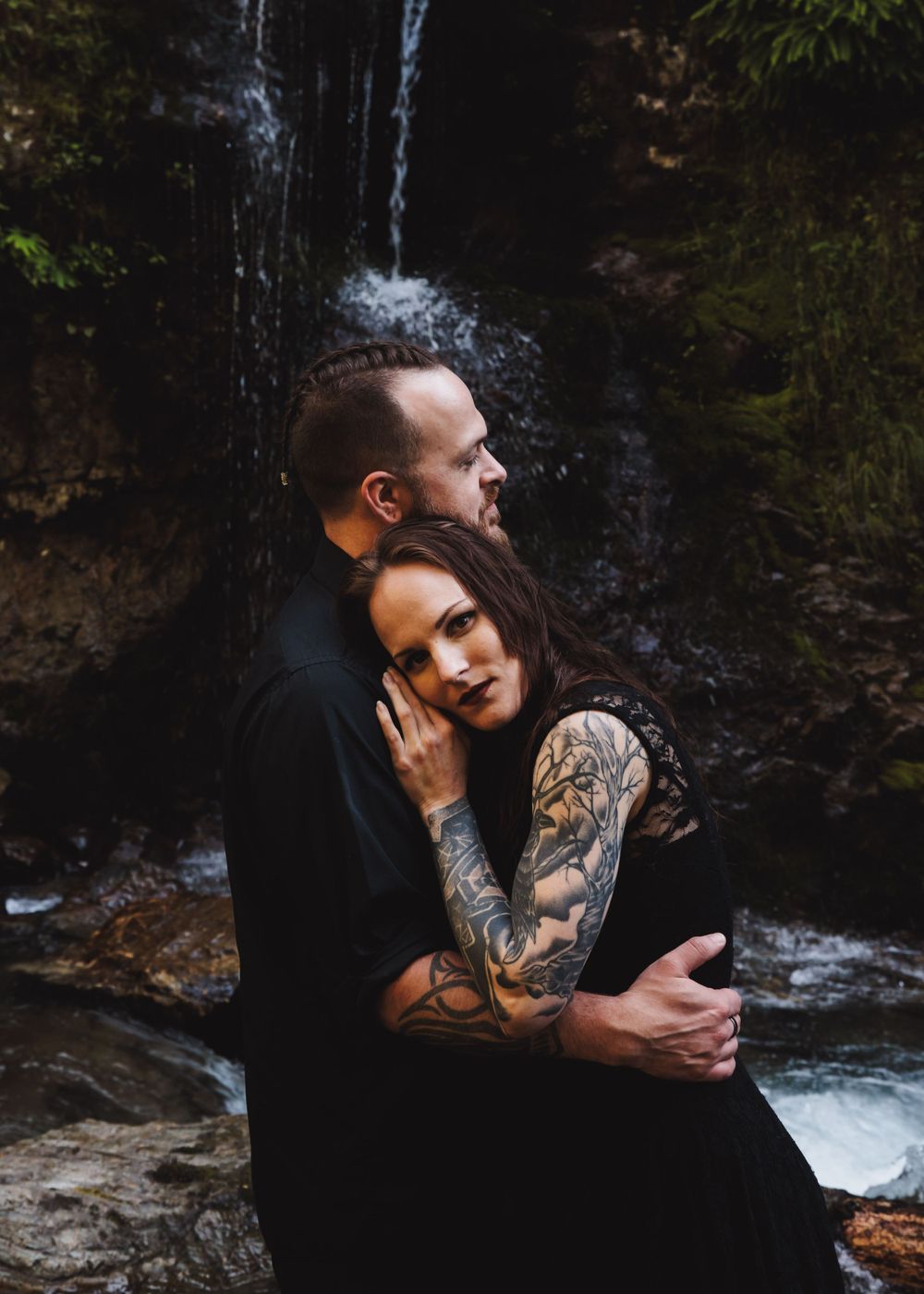 Couple standing on a Snohomish riverbank for engagement photos. Raw, natural photography by Tim Neal.