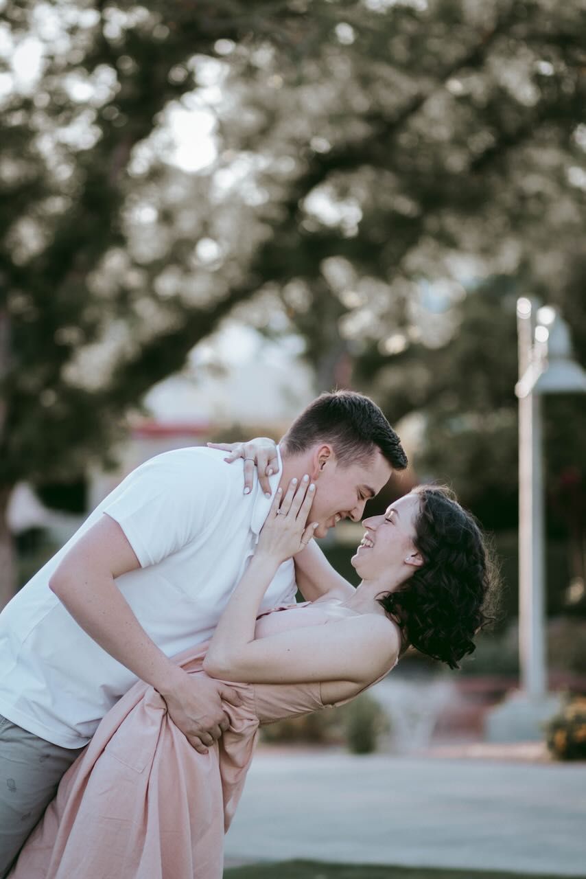 Candid moment of an engaged couple laughing in Snohomish. Warm and authentic engagement session by Tim Neal.
