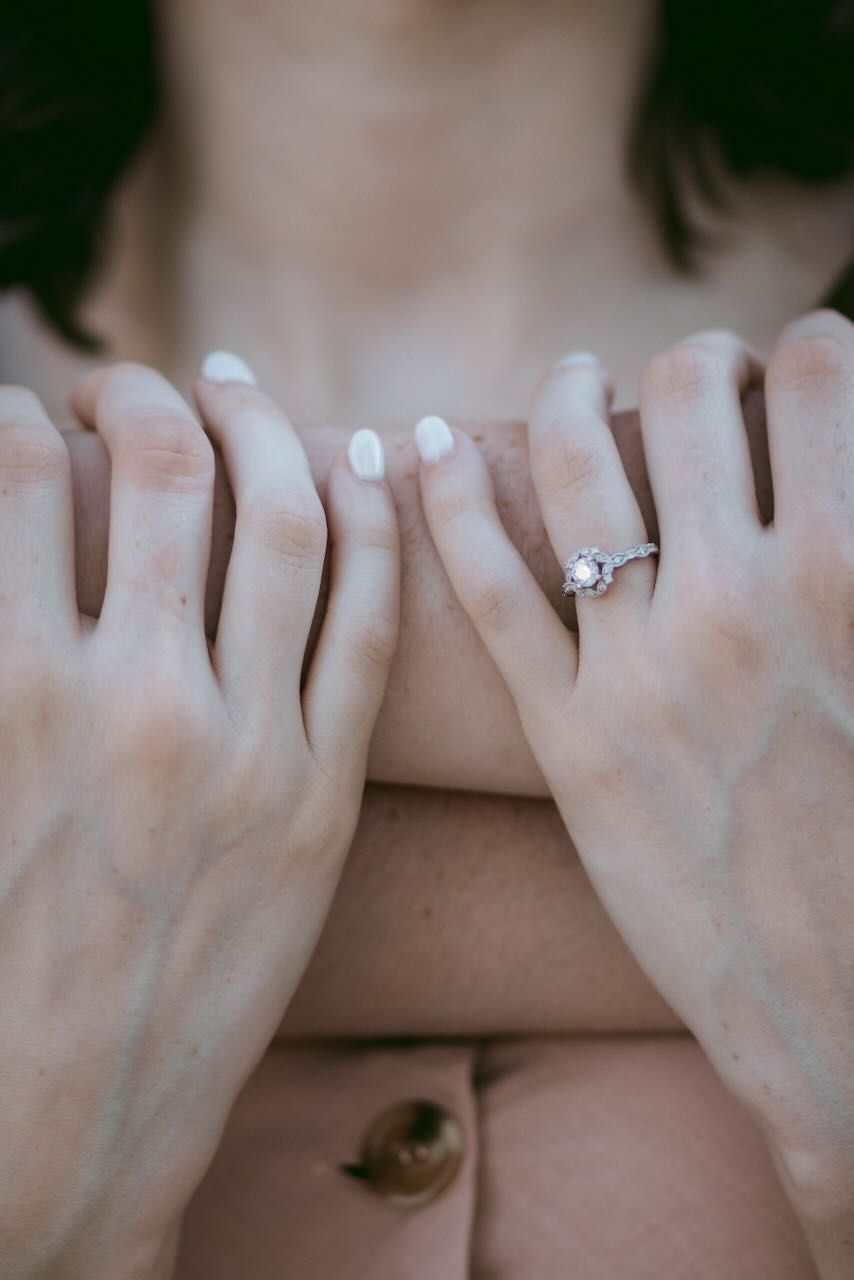 Detailed shot of an engagement ring on a bride-to-be’s hand in Snohomish. Intimate details by Tim Neal.